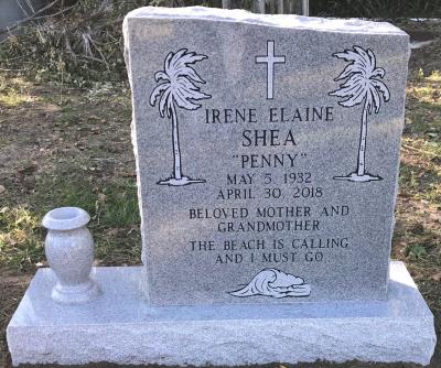 single gray granite upright headstone with beach theme
